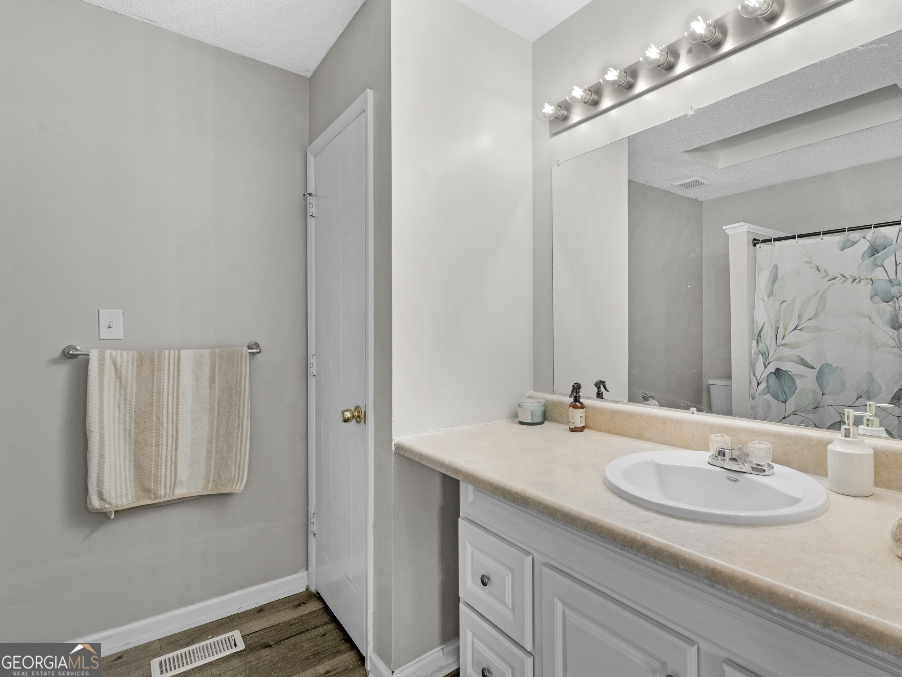 111 Neal Avenue Stockbridge, GA 30281 - Photo 21 of 27 a bathroom with a sink double vanity and a mirror