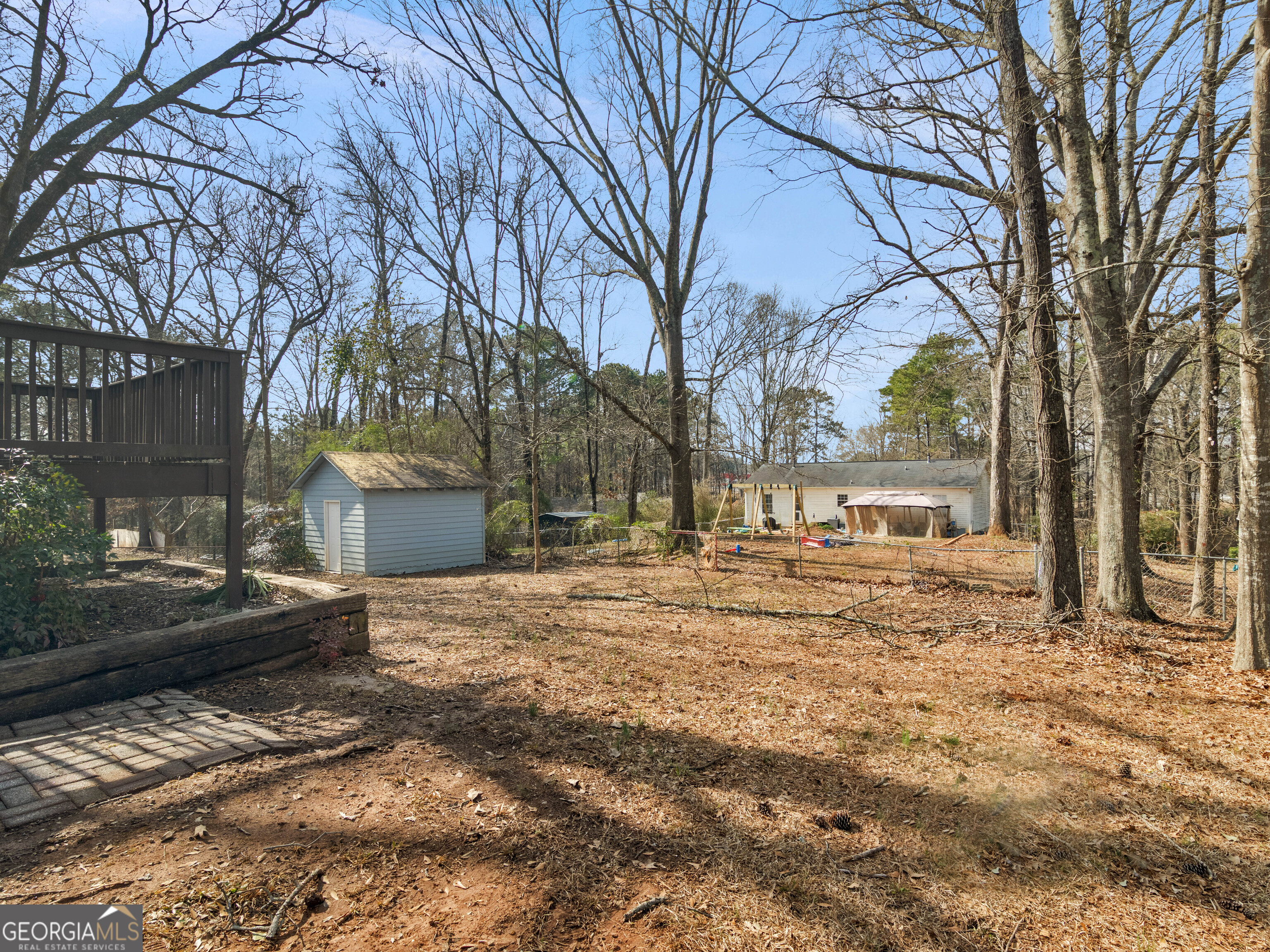 111 Neal Avenue Stockbridge, GA 30281 - Photo 25 of 27 a view of a house with a yard covered in snow