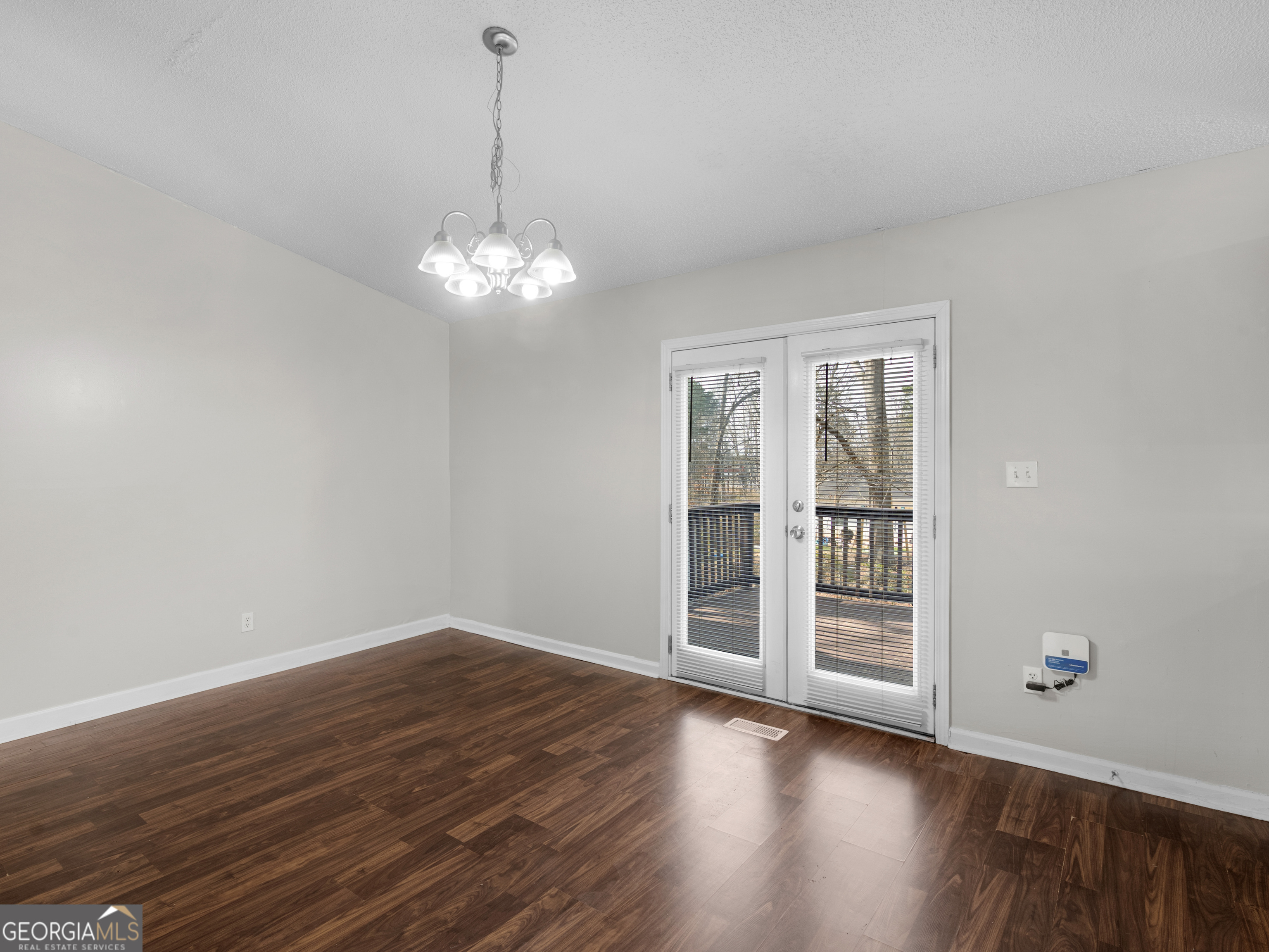 111 Neal Avenue Stockbridge, GA 30281 - Photo 6 of 27 a view of wooden floor and windows in a room