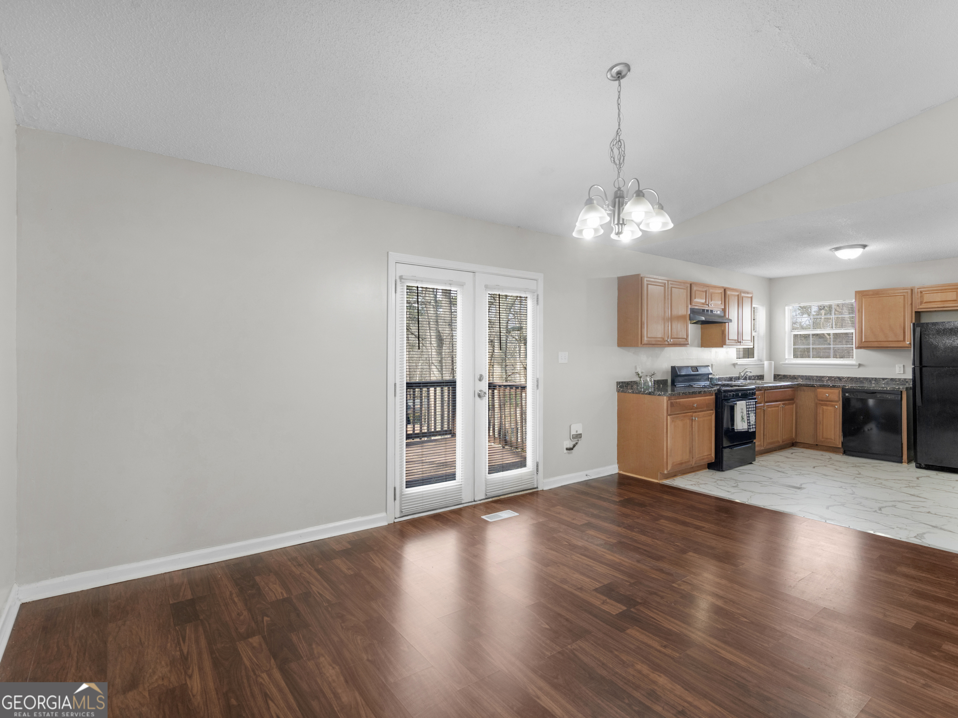 111 Neal Avenue Stockbridge, GA 30281 - Photo 7 of 27 a view of a kitchen with furniture and wooden floor
