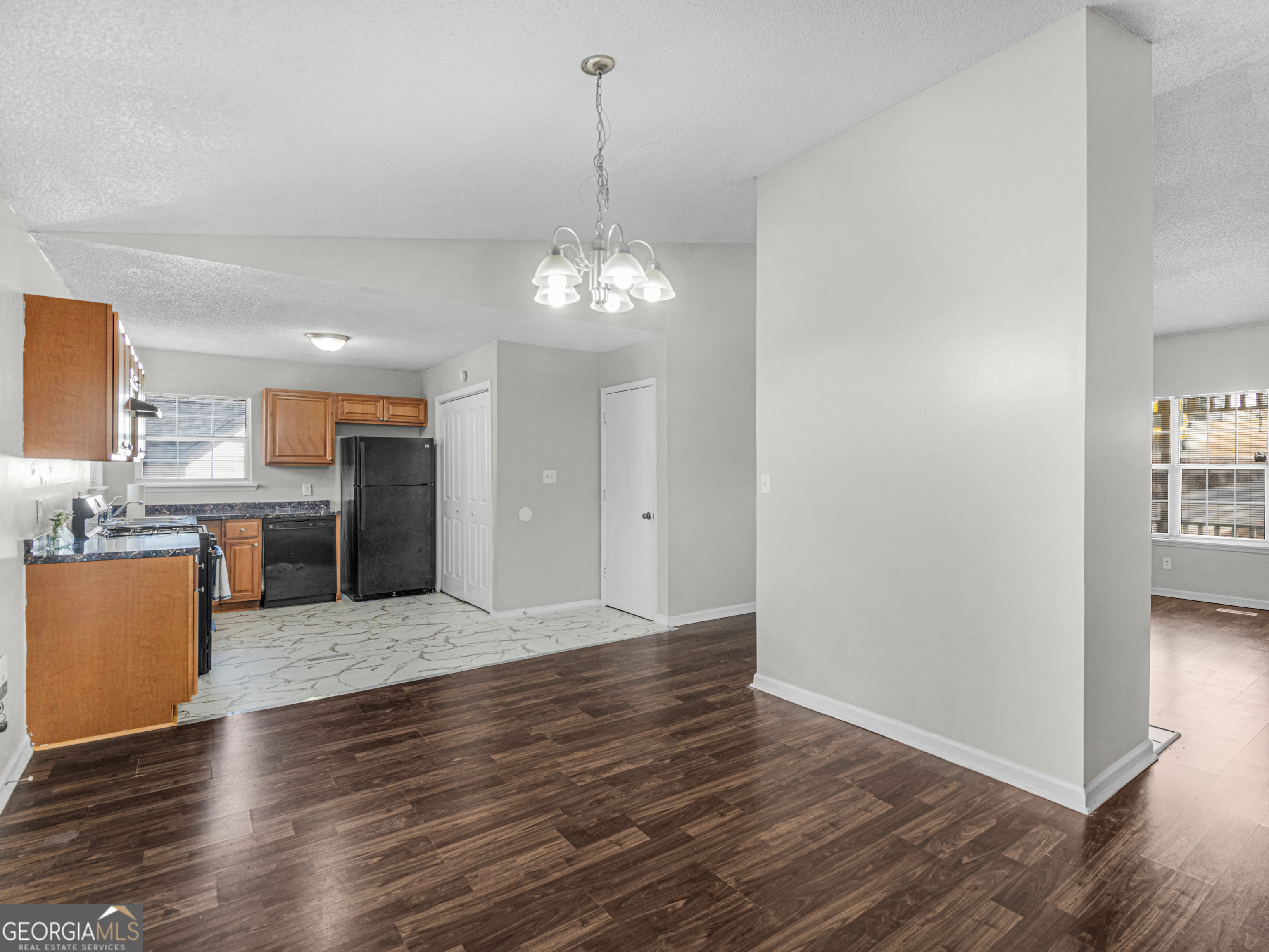 111 Neal Avenue Stockbridge, GA 30281 - Photo 8 of 27 a view of a kitchen with wooden floor and a kitchen