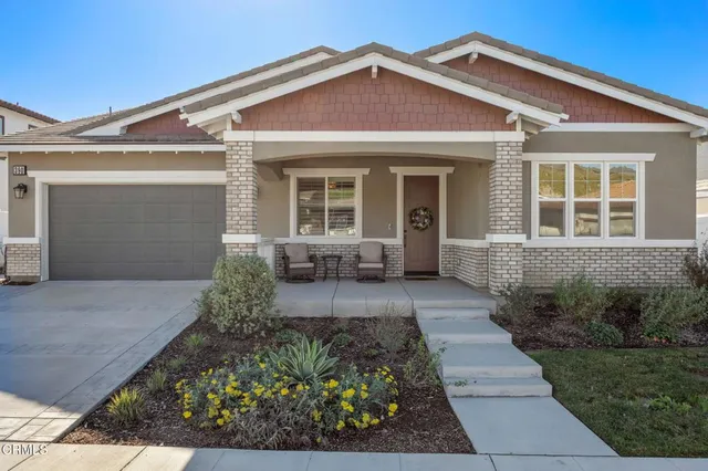 front view of a house with a small yard