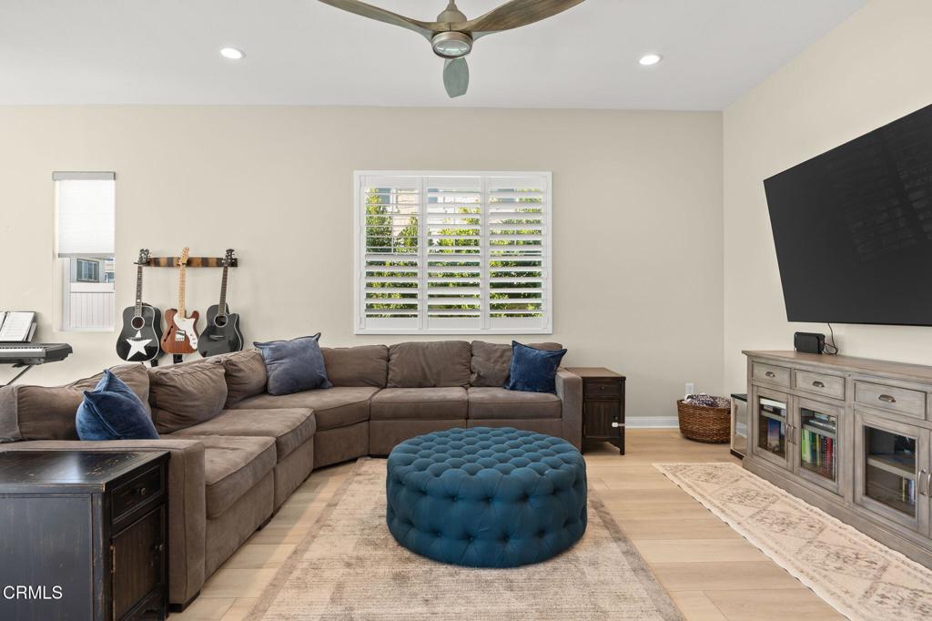 390 Rose Street Fillmore, CA 93015 - Photo 15 of 58 a living room with furniture and a flat screen tv