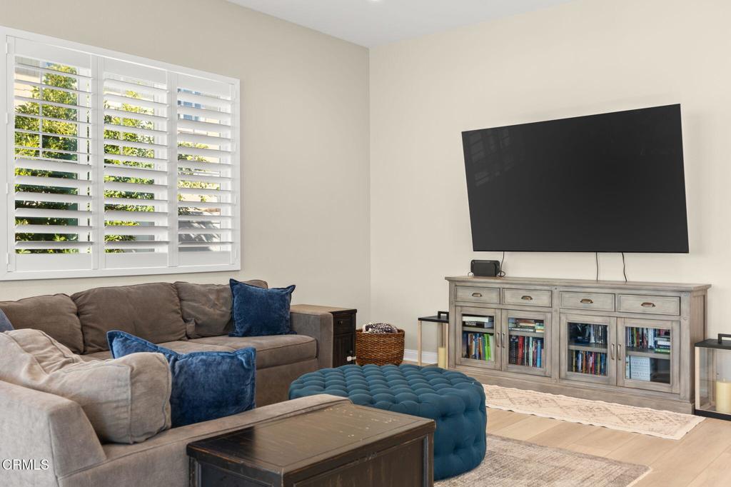 390 Rose Street Fillmore, CA 93015 - Photo 16 of 58 a living room with furniture and a flat screen tv