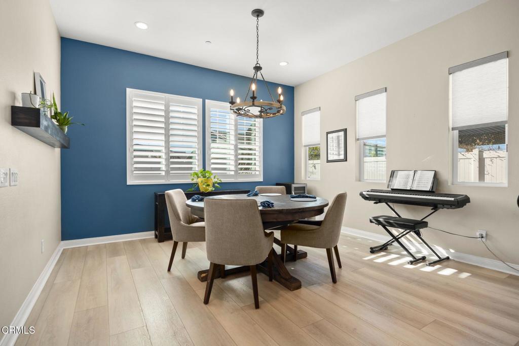 390 Rose Street Fillmore, CA 93015 - Photo 20 of 58 a view of a dining room with furniture window and wooden floor