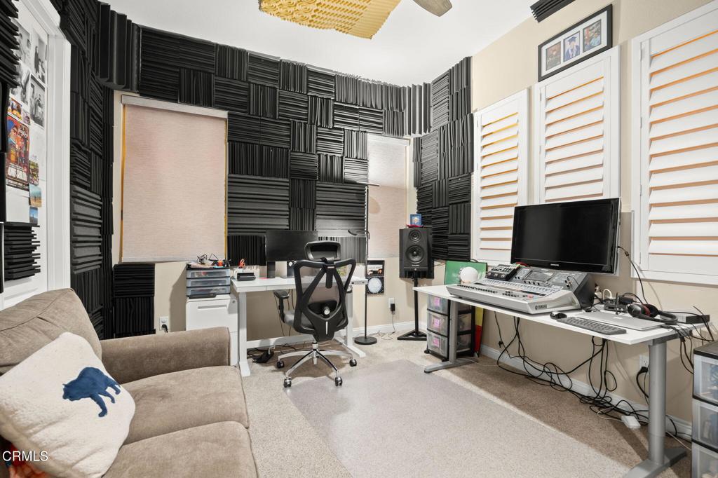 390 Rose Street Fillmore, CA 93015 - Photo 27 of 58 a living room with furniture and a flat screen tv