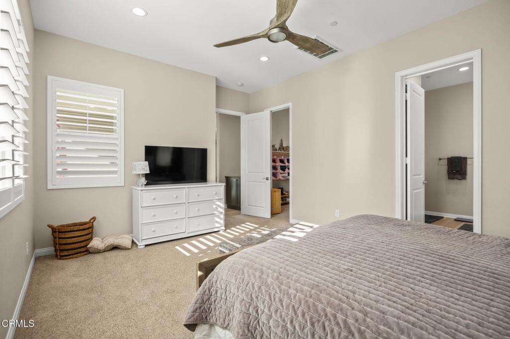 390 Rose Street Fillmore, CA 93015 - Photo 30 of 58 a bedroom with a bed and a flat screen tv