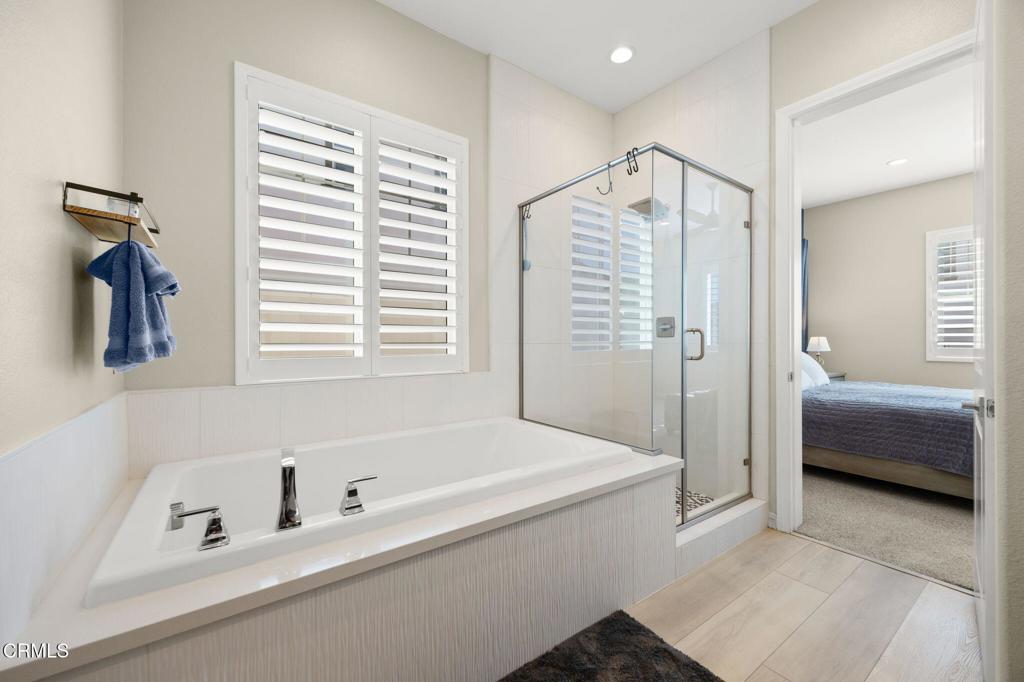 390 Rose Street Fillmore, CA 93015 - Photo 32 of 58 a bathroom with a tub a sink and a shower