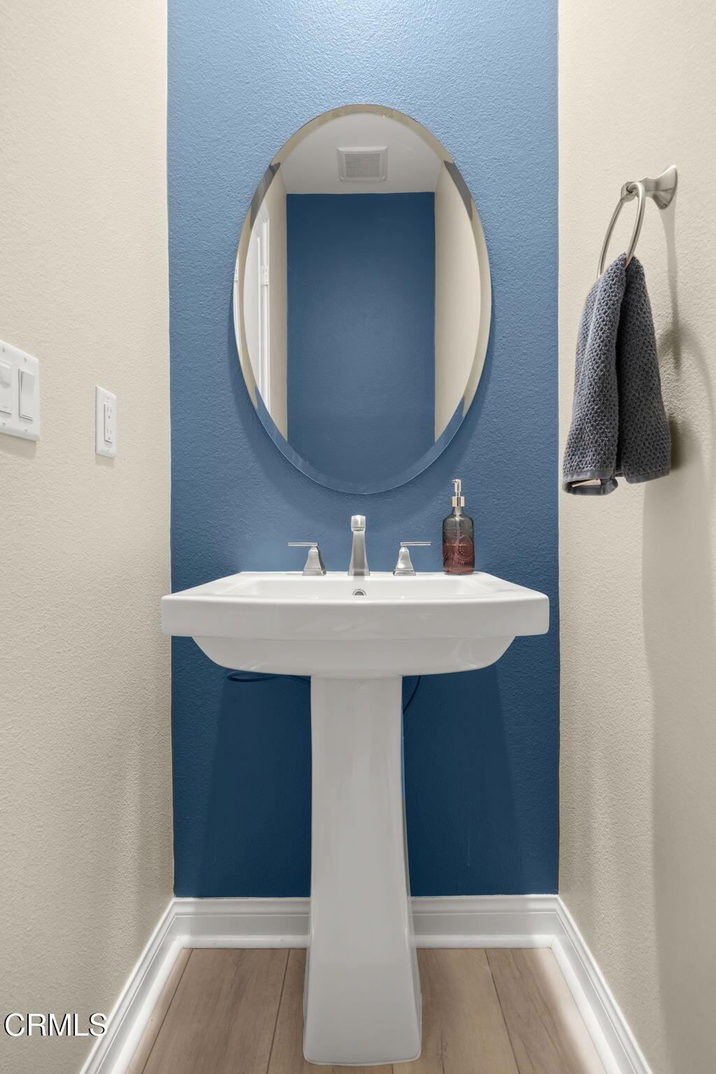 390 Rose Street Fillmore, CA 93015 - Photo 34 of 58 a bathroom with a sink and a mirror