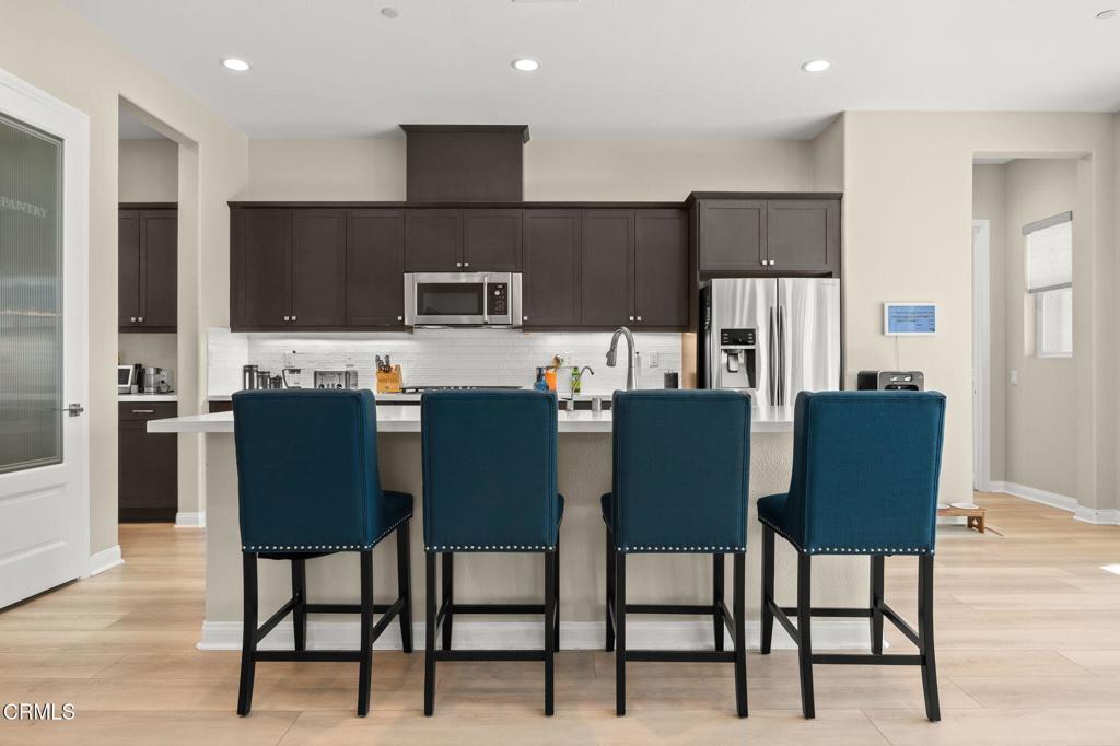 390 Rose Street Fillmore, CA 93015 - Photo 9 of 58 a view of kitchen dining table and chairs