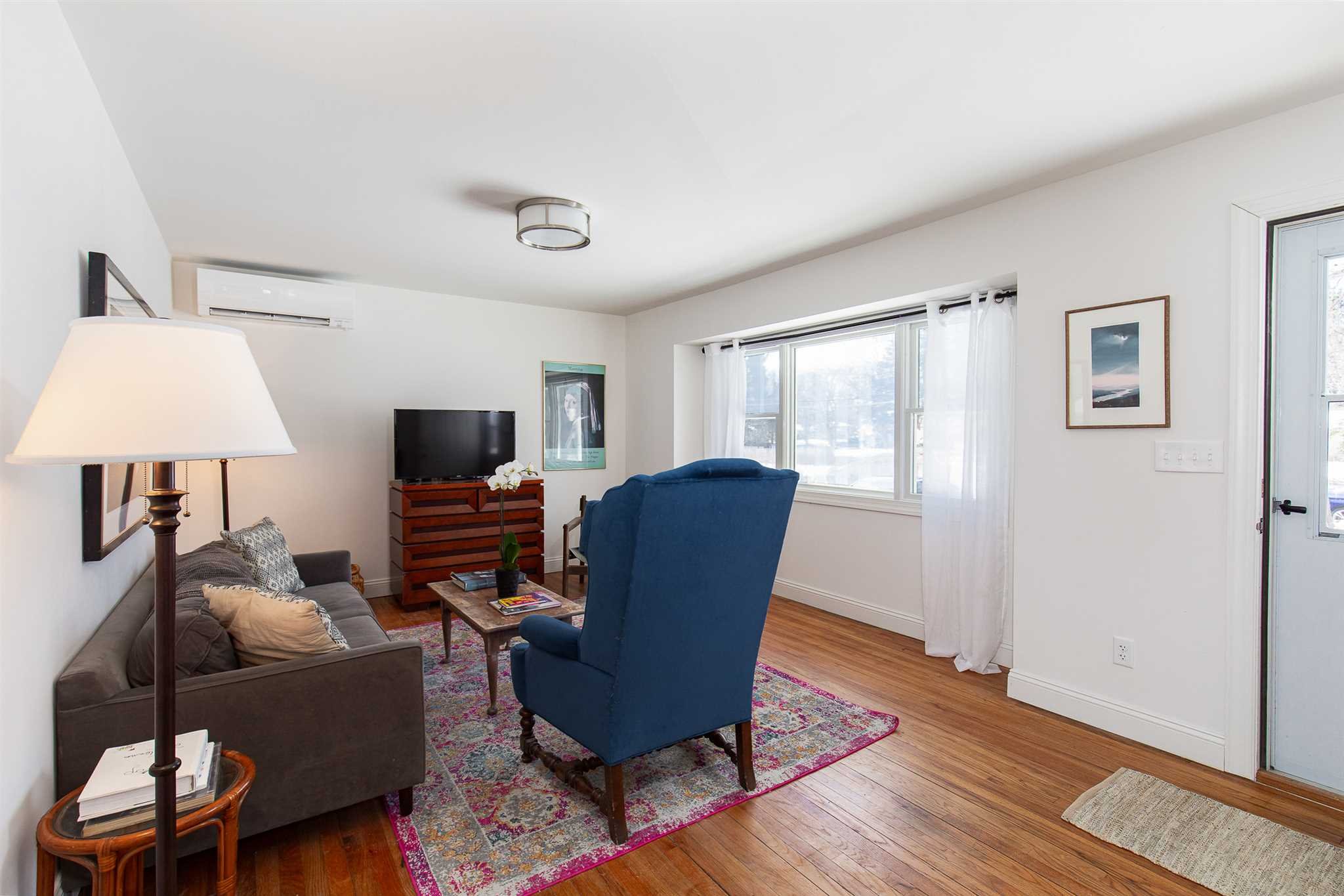2 Cambridge Drive Red Hook, NY 12571 - Photo 2 of 17 a living room with furniture a window and a flat screen tv