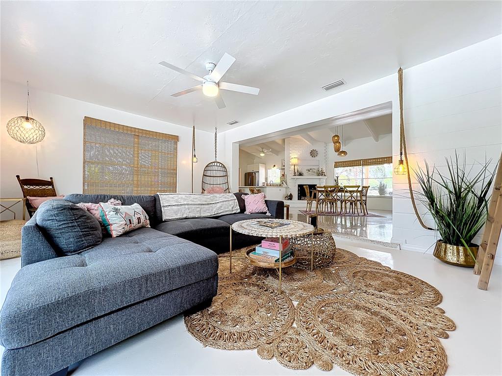 3228 Webber Street Sarasota, FL 34239 - Photo 11 of 39 a living room with furniture potted plant and a large window