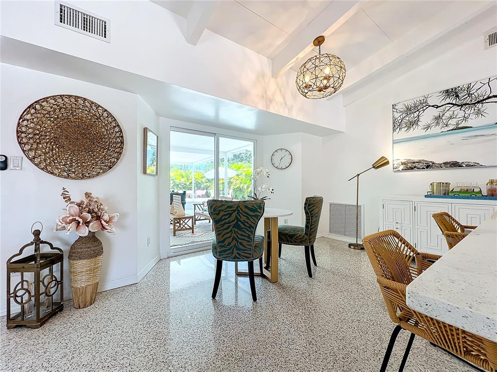 3228 Webber Street Sarasota, FL 34239 - Photo 14 of 39 a view of a dining room with furniture and chandelier