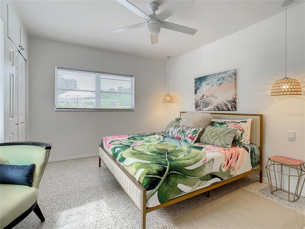 3228 Webber Street Sarasota, FL 34239 - Photo 18 of 39 a bedroom with a bed and a couch