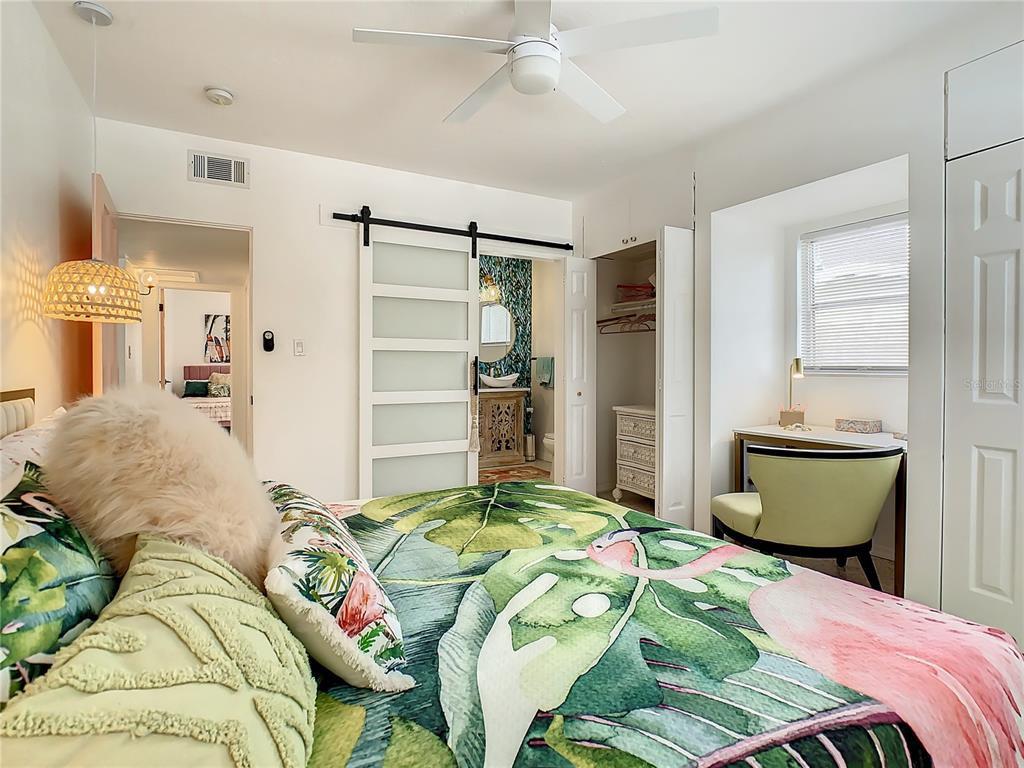 3228 Webber Street Sarasota, FL 34239 - Photo 19 of 39 a bedroom with a bed and a refrigerator