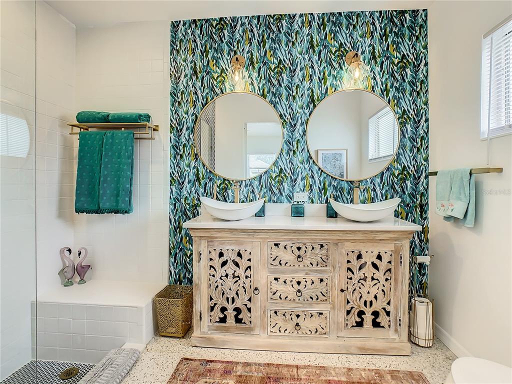 3228 Webber Street Sarasota, FL 34239 - Photo 20 of 39 a bathroom with a mirror and a sink