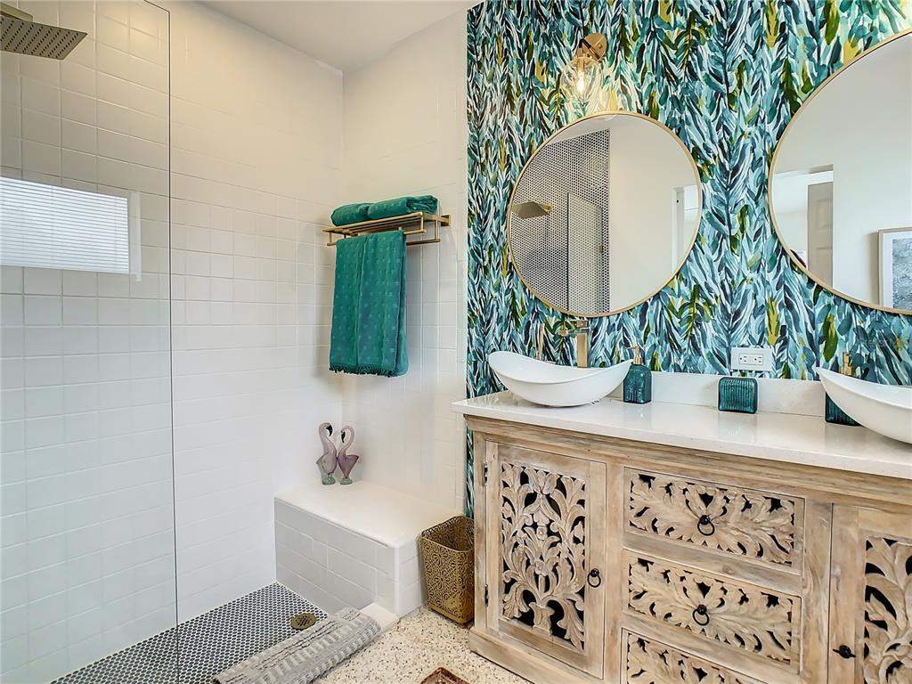3228 Webber Street Sarasota, FL 34239 - Photo 21 of 39 a bathroom with a sink mirror and vanity