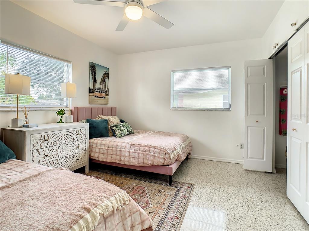 3228 Webber Street Sarasota, FL 34239 - Photo 24 of 39 a bedroom with two beds and painting on the wall
