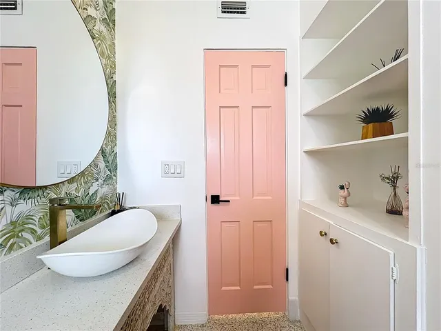 a kitchen with a sink stove and cabinets