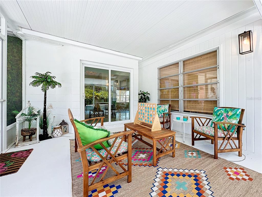 3228 Webber Street Sarasota, FL 34239 - Photo 32 of 39 a living room filled with furniture and a table