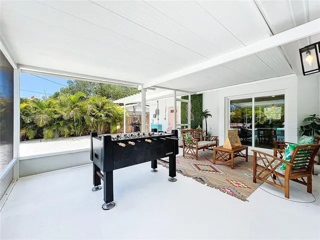 a view of a porch with furniture