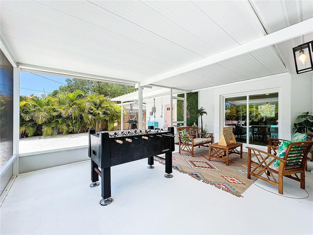 3228 Webber Street Sarasota, FL 34239 - Photo 33 of 39 a living room with furniture and a large window