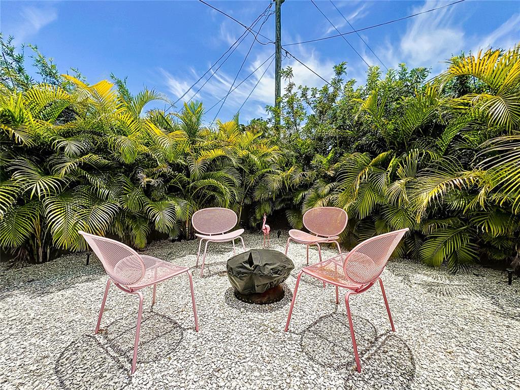 3228 Webber Street Sarasota, FL 34239 - Photo 37 of 39 a view of a chairs and table in a patio