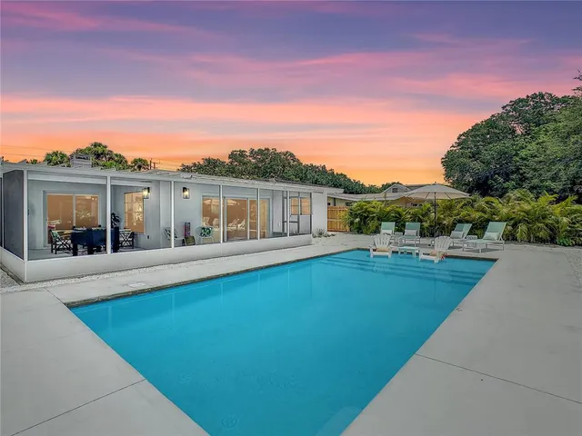 a view of a dining room and livingroom with furniture