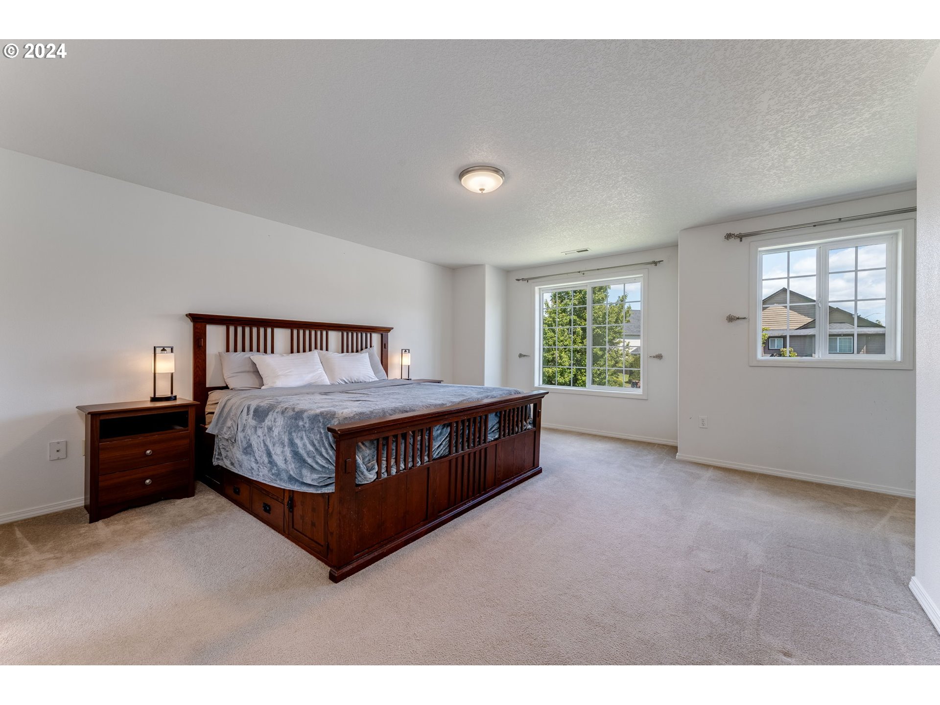 805 Raven Drive Ridgefield, WA 98642 - Photo 16 of 35 a bedroom with a bed window and dresser