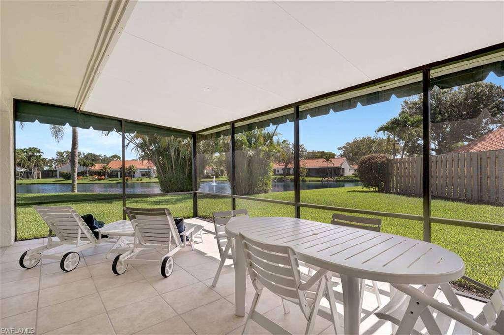 731 Reef Point Circle Naples, FL 34108 - Photo 27 of 47 a view of swimming pool with lawn chairs and a yard