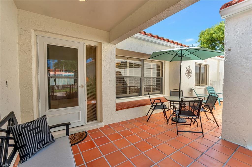 731 Reef Point Circle Naples, FL 34108 - Photo 3 of 47 a outdoor space with chairs