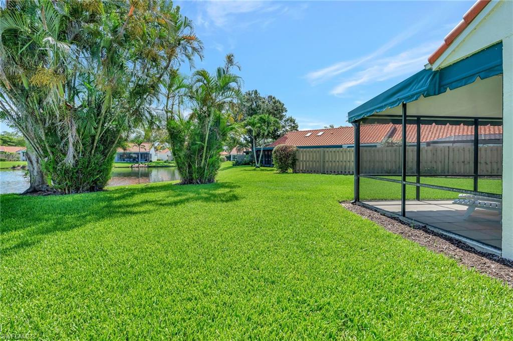 731 Reef Point Circle Naples, FL 34108 - Photo 31 of 47 a view of a house with a backyard