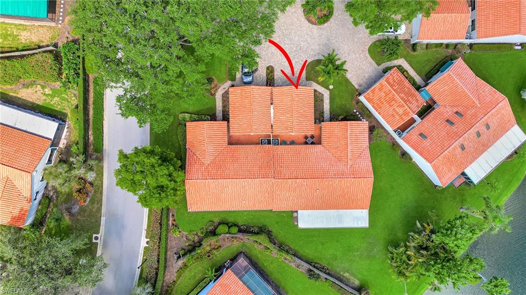 731 Reef Point Circle Naples, FL 34108 - Photo 35 of 47 an aerial view of multiple houses with yard