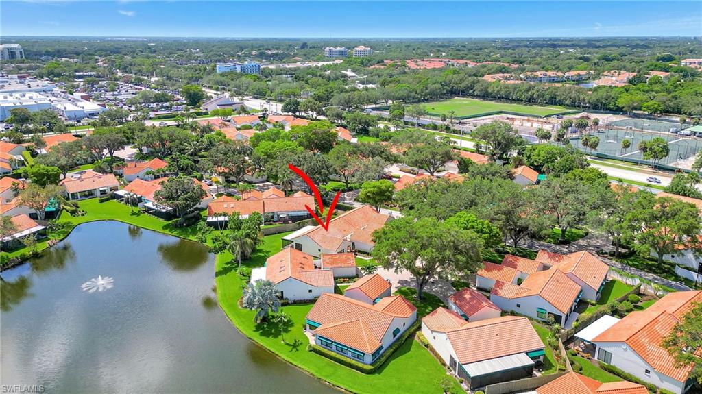 731 Reef Point Circle Naples, FL 34108 - Photo 38 of 47 an aerial view of residential houses with outdoor space and trees