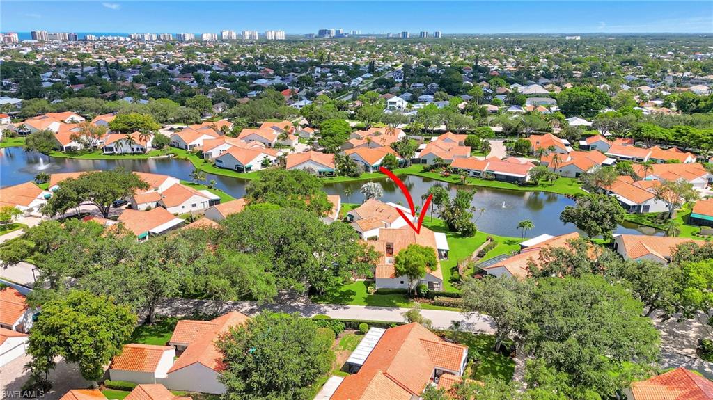 731 Reef Point Circle Naples, FL 34108 - Photo 39 of 47 an aerial view of residential houses with outdoor space and trees