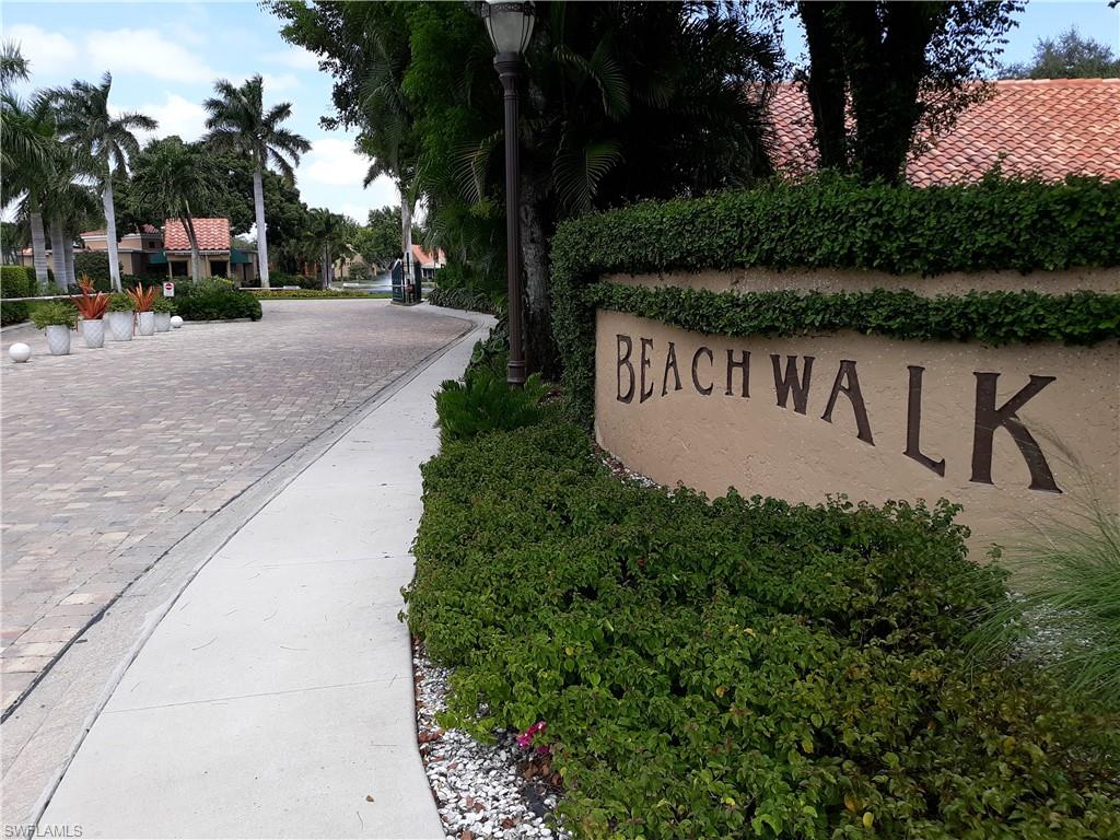 731 Reef Point Circle Naples, FL 34108 - Photo 41 of 47 a view of a street with a bench in front of it
