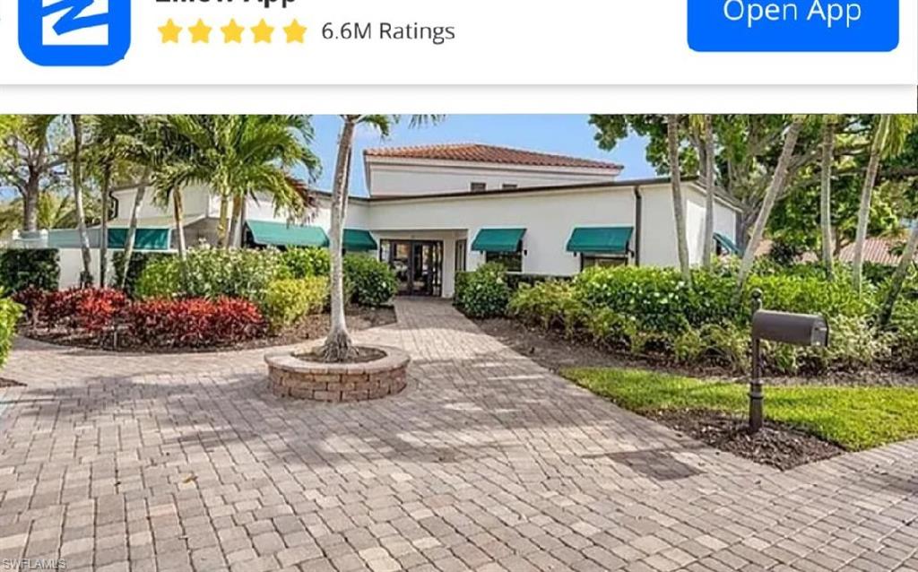 731 Reef Point Circle Naples, FL 34108 - Photo 42 of 47 a front view of a house with a yard