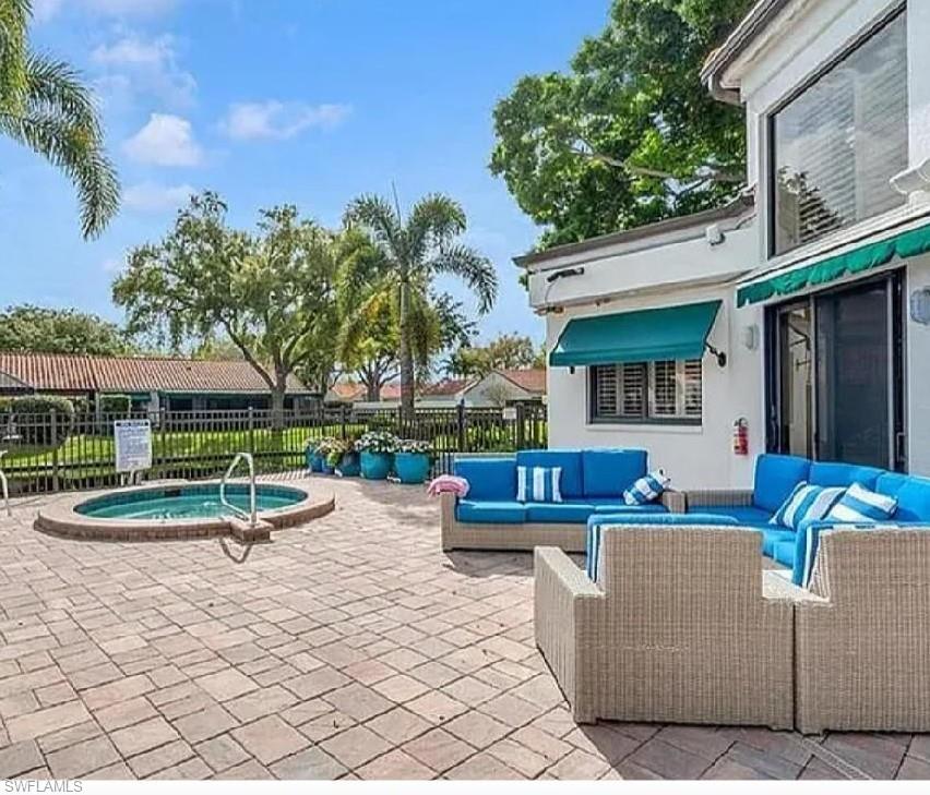 731 Reef Point Circle Naples, FL 34108 - Photo 44 of 47 a view of a house with backyard and a patio