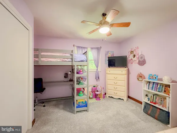 a room with a dresser and a mirror