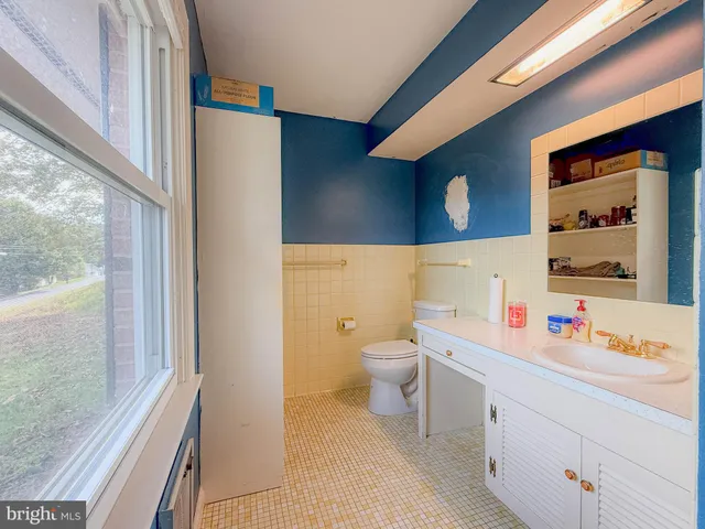 a children room with toys and a window