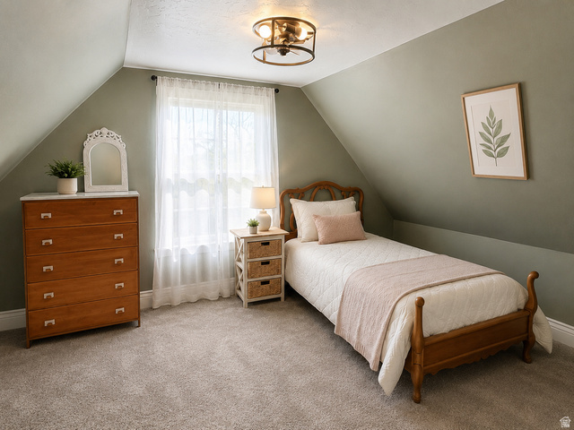 137 West 200 S Street Fairview, UT 84629 - Photo 8 of 34 Room featuring sloped ceilings, a window with sheer curtains, recessed wall sections, and a ceiling-mounted light fixture with a metal frame