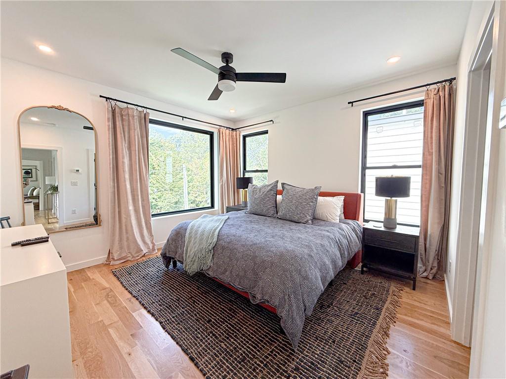 825 Barnett Street Northeast Atlanta, GA 30306 - Photo 11 of 44 a bedroom with a large bed and a window