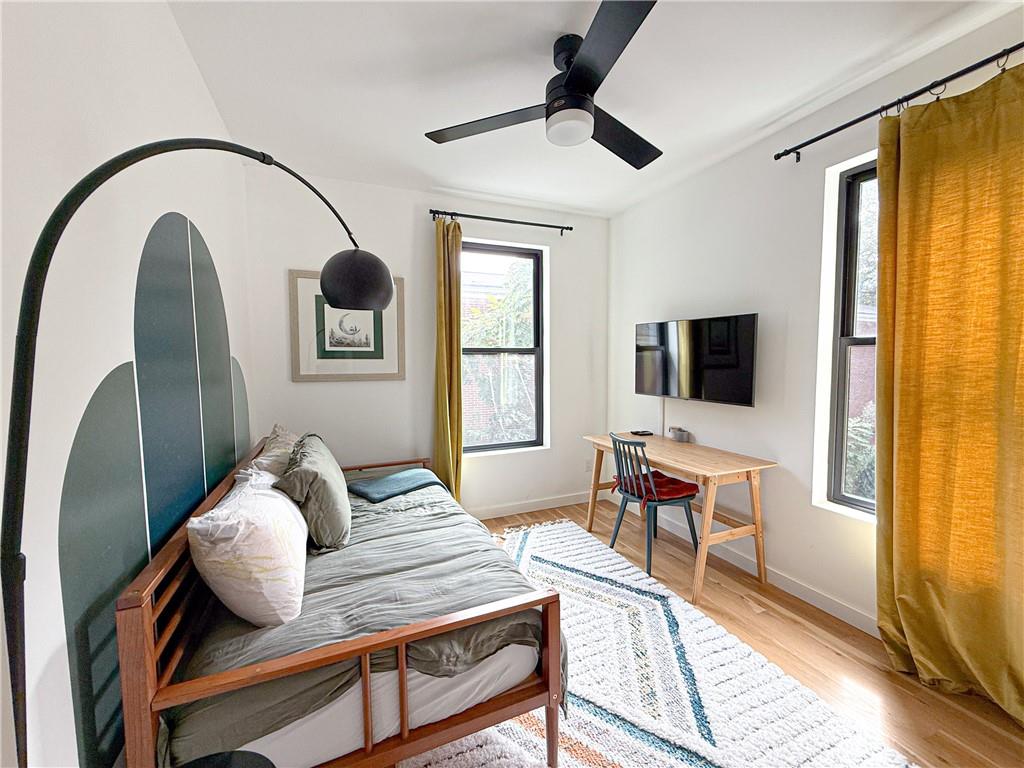 825 Barnett Street Northeast Atlanta, GA 30306 - Photo 18 of 44 a bedroom with furniture and a window