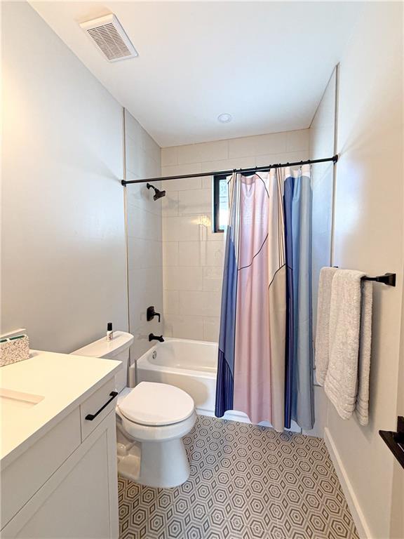 825 Barnett Street Northeast Atlanta, GA 30306 - Photo 19 of 44 a bathroom with a toilet sink and a shower
