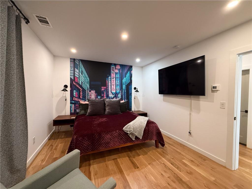 825 Barnett Street Northeast Atlanta, GA 30306 - Photo 21 of 44 a living room with furniture and a flat screen tv