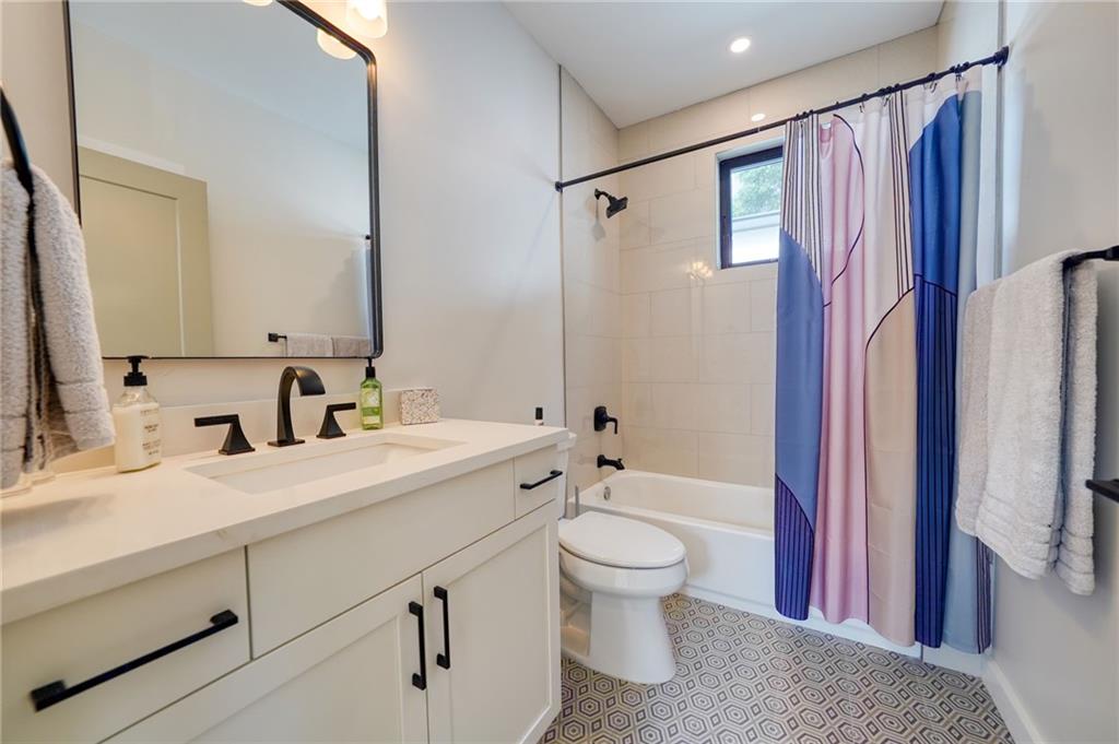 825 Barnett Street Northeast Atlanta, GA 30306 - Photo 28 of 44 a bathroom with a sink a toilet and shower