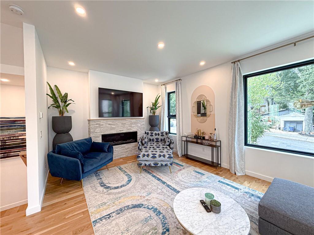 825 Barnett Street Northeast Atlanta, GA 30306 - Photo 3 of 44 a living room with furniture fireplace and flat screen tv
