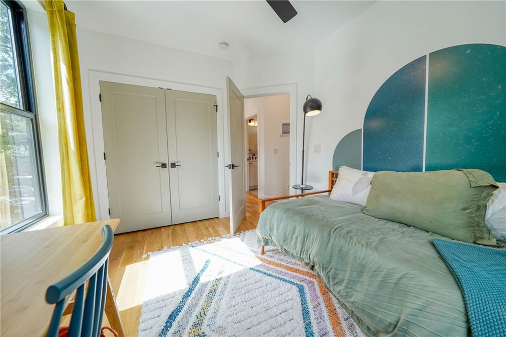 825 Barnett Street Northeast Atlanta, GA 30306 - Photo 32 of 44 a bed sitting in a bedroom next to a window