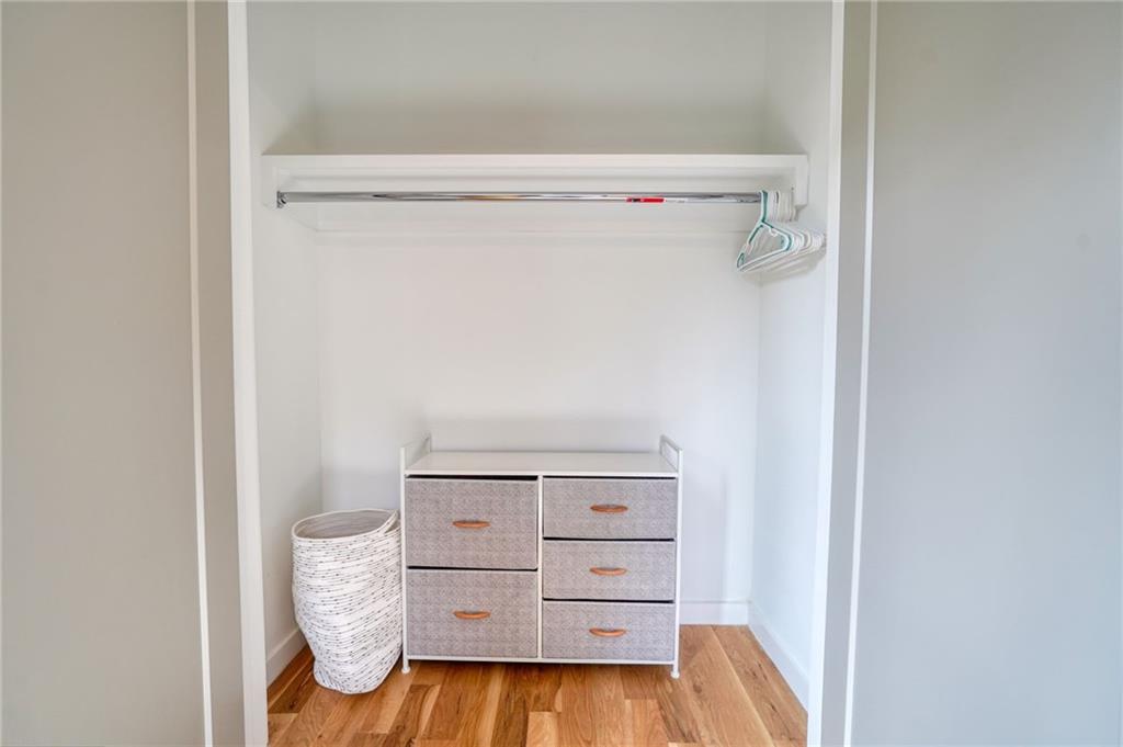 825 Barnett Street Northeast Atlanta, GA 30306 - Photo 33 of 44 a view of walk in closet with clothes and shoes
