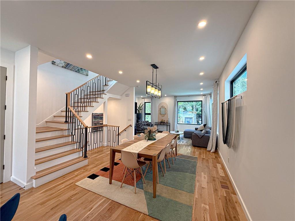 825 Barnett Street Northeast Atlanta, GA 30306 - Photo 5 of 44 a view of a dining room with furniture a rug and wooden floor